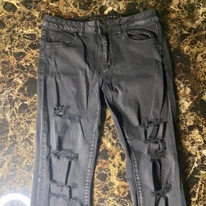 Ripped Black American Eagle Jeans.